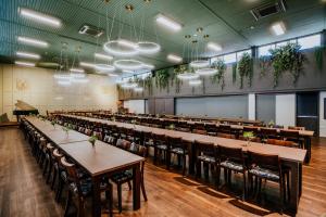 a large banquet hall with tables and chairs at St Catherine's on Park in Perth