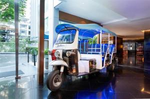 a small golf cart parked in a building at Radisson Suites Bangkok Sukhumvit in Bangkok
