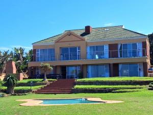 a large house with a pool in front of it at Seaside on Southend in East London
