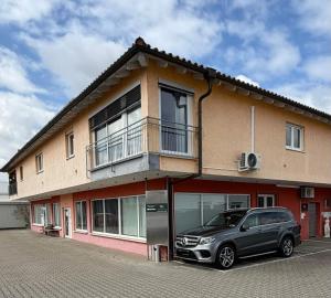 a car parked in front of a building at Wohnkultur - Industrial Loft Schwetzingen in Schwetzingen