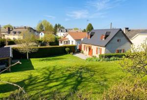 a group of houses in a yard with green grass at Gite de l'isarce in Montaut