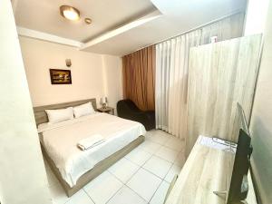 a bedroom with a bed in a room at Liva in Ho Chi Minh City