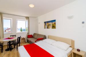 Posteľ alebo postele v izbe v ubytovaní Apartments Villa Ankora
