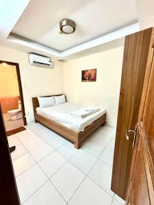 a bedroom with a bed in a room at Liva in Ho Chi Minh City