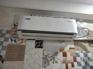 a printer sitting on top of a tile floor at Agrasen Homestay in Prayagraj