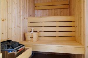 a sauna with a bucket on thevisor of it at Villa Raphael w Jacuzzi near Pirin Golf Resort in Bansko +54 photos