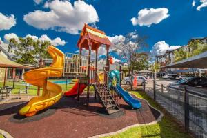 a playground with a slide in a park at Above Cozy Corner Amsterdam in Northriding