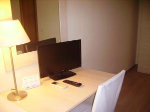 a computer monitor sitting on top of a desk at Hotel Angela e Vincenzo in Cava deʼ Tirreni