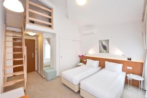 a bedroom with two beds and a loft bed at Villa 21 Victus by Noclegi Renters in Sopot