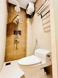 a bathroom with a toilet and a shower at Happy House in Danang