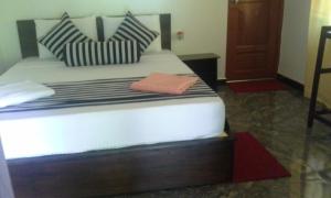 Letto o letti in una camera di Nethmi Homestay