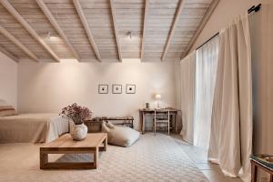 a bedroom with a bed and a table at Casa Das Ferreñas in Melide +104 photos