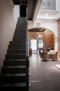 a staircase in a building with a stair case at Aayu Melayu - George Town Penang in George Town