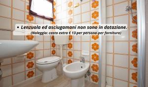 a bathroom with a toilet and a sink at Low Cost Studio Fieramosca in Lido di Spina +78 photos
