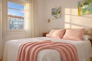 a bedroom with a bed with a window at Señorial Panorámico by apartamentoscatedralcamino in Burgos