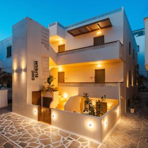 a facade of a house with lights at Chic Elysium in Naxos Chora