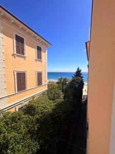 a view of the ocean from a building at Hotel Gandolfo in Alassio