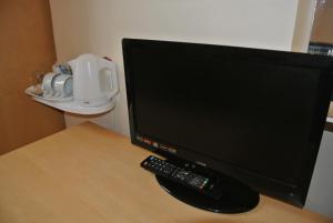 TV a/nebo společenská místnost v ubytování European Hotel