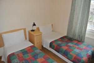 Postel nebo postele na pokoji v ubytování European Hotel