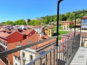 a view of a city from a balcony at Señorial Panorámico by apartamentoscatedralcamino in Burgos