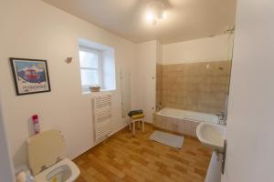 a bathroom with a toilet and a sink and a tub at La Boisselée in Saint-Dyé-sur-Loire +49 photos