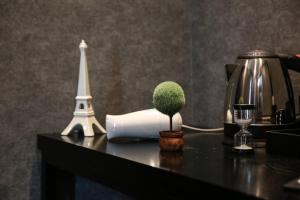 a miniature tree on a table with a eiffel tower at Hotel Senne in Seoul