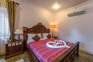 A bed or beds in a room at Delux Villa