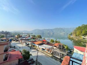 a view of a town next to a river at Hotel Everest Lake View in Pokhara