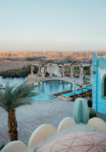 a swimming pool with a view of the desert at Kato Dool Wellness Resort in Aswan