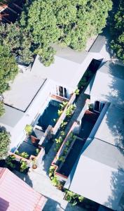 an overhead view of a house with a swimming pool at The S - Luxurious Stays in Mahabaleshwar