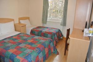 Postel nebo postele na pokoji v ubytování European Hotel