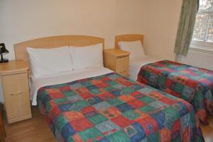 Postel nebo postele na pokoji v ubytování European Hotel