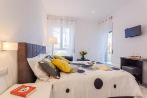 Un pat sau paturi într-o cameră la Ba.Home