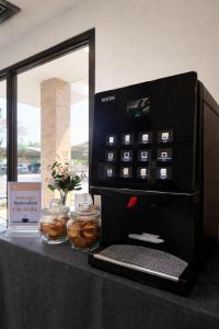 a black counter with a laptop on top of it at Mark Four Place Hotel in Phrae +42 photos