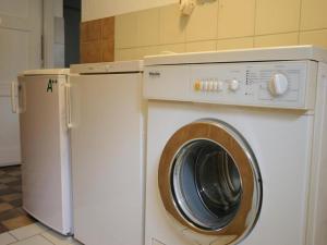 a washing machine and a dryer in a room at Chalet Gamper by Summit Travel in Ellmau +7 photos