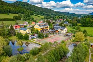 an aerial view of a small town with a river at Apartmány U stezek in Lipova Lazne