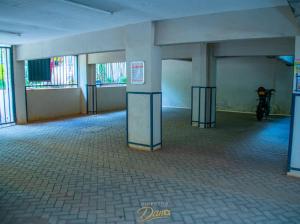 a empty room with a motorcycle parked in it at Kanotis place in Ongata Rongai 