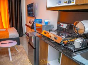 a kitchen with a machine on a counter in a room at Kanotis place in Ongata Rongai 