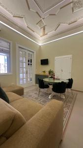 a living room with a couch and a table at Tropea Belle Époque in Tropea