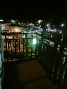 a balcony with a view of a city at night at Pailin Daily F2 in Phetchabun +3 photos