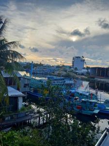 a group of boats are docked in a harbor at Hotel View Sông Phú Quốc in Phú Quốc