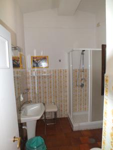 a bathroom with a shower and a sink at Locanda Laudomia in Manciano +42 photos