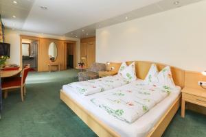 Krevet ili kreveti u jedinici u okviru objekta Alpenhotel Tauernstüberl