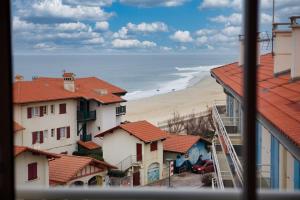 a view from a window of a beach and buildings at Central View, Hossegor, Plage, Famille in Hossegor