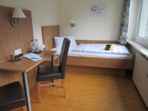Postel nebo postele na pokoji v ubytování Das Gästehaus Puschendorf