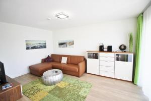 a living room with a couch and a coffee table at Golfresidenz D 0 06 in Grömitz