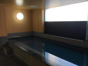 an empty swimming pool in a gymnasium at Hotel Crown Hills Kanazawa in Kanazawa