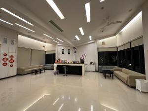 a large lobby with couches and a table in a building at Lan Yang Resort Four Seasons in Dongshan