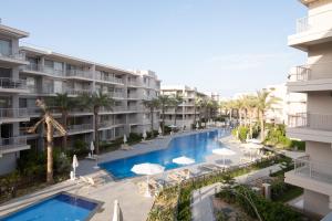 an image of a swimming pool at a resort at BirdNest Vacation homes at Marassi marina in El Alamein