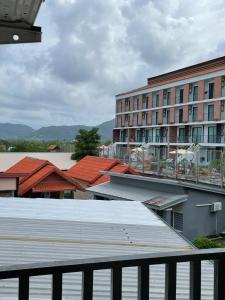 a view of a building and a building with red roofs at The Smoke Shop in Ban Suan